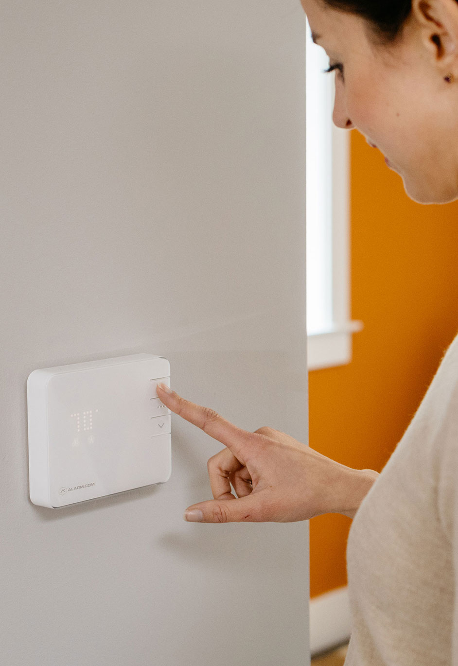 Homeowner Using Smart Thermostat