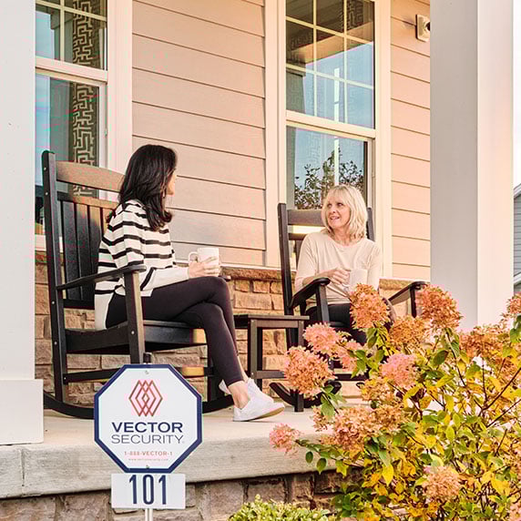 Vector Image Asset-/contentassets/984c7afe87d14f33a73c3e033a463732/talking-outside-near-yard-sign-and-outdoor-camera.jpg